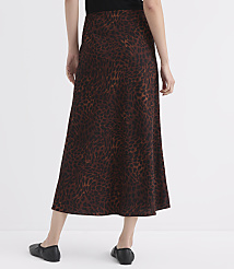 A person wearing a brown leopard-print skirt and black flats stands against a plain white background. carousel Product Image 3