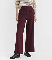 A person in maroon wide-leg pants and a striped sweater stands against a plain white background. carousel Product Image 2