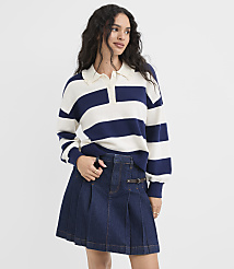 A young woman in a striped sweater and denim skirt stands against a plain white background. carousel Product Image 1