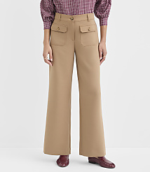 A person in tan wide-leg pants with flap pockets and a patterned blouse stands against a plain white background. carousel Product Image 2