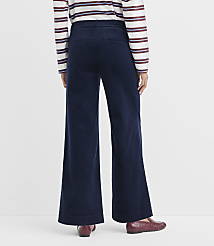 A person wearing navy corduroy wide-leg pants and a striped shirt stands against a plain white background. carousel Product Image 3