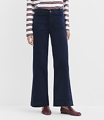 A person wearing navy wide-leg corduroy pants and a striped shirt stands against a plain white background. carousel Product Image 2