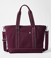 A maroon canvas tote bag with white stitching and a detachable shoulder strap sits against a plain white background. carousel Product Image 1