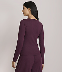 A woman in a burgundy ribbed long-sleeved shirt and matching pants stands against a plain, light gray background. carousel Product Image 3