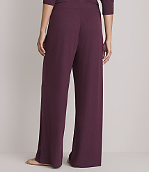 A person wearing plum-colored wide-leg pajama pants stands against a plain gray background. carousel Product Image 3