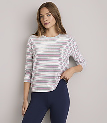 A woman in a striped shirt and navy leggings stands against a plain white background. carousel Product Image 2