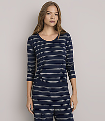 A woman in a striped top and pants stands against a plain gray background. carousel Product Image 2
