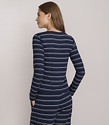 A woman in a navy and white striped long-sleeved shirt stands against a plain white background. carousel Product Image 3