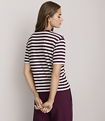 A woman in a striped t-shirt and maroon pants stands against a plain white background. carousel Product Image 3