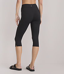 A person wearing black capri leggings and sandals stands against a plain white background. carousel Product Image 3