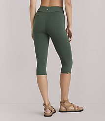 A woman in green capri leggings and sandals stands against a plain white background. carousel Product Image 3