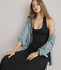 A woman in a black halter maxi dress and sandals stands against a plain white background. carousel Product Image 2