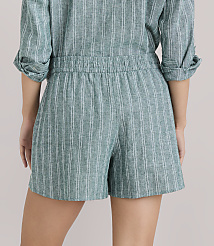 A person wearing a green and white striped romper is shown from the back, with a plain white background. carousel Product Image 3