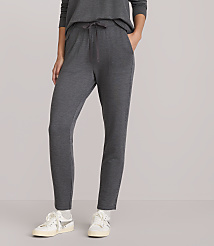 A person wearing dark gray sweatpants and white sneakers stands against a plain white background. carousel Product Image 2
