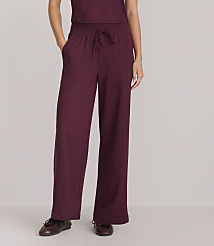 A person wearing maroon wide-leg pants and brown shoes stands against a plain gray background. carousel Product Image 2