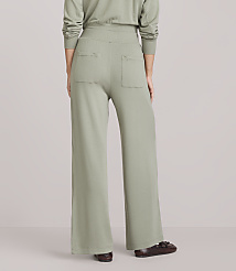 A person wearing light green wide-leg pants and brown loafers stands against a plain white background. carousel Product Image 3