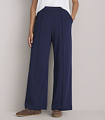 A person wearing navy blue wide-leg pants and brown shoes stands against a plain gray background. carousel Product Image 2