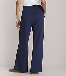 A person wearing navy blue wide-leg pants and brown shoes stands against a plain white background. carousel Product Image 3