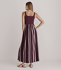 A woman in a maroon and white striped maxi dress stands against a plain white background. carousel Product Image 3