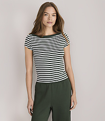 A woman in a striped shirt and green pants stands against a plain white background. carousel Product Image 1