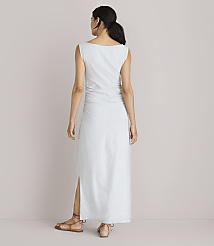 A woman in a light gray maxi dress with ruched detailing and a side slit stands with her back to the camera against a plain white background. carousel Product Image 3