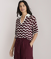A woman in a chevron-patterned top and maroon wide-leg pants stands against a plain white background. carousel Product Image 1
