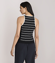 A woman in a black and white striped tank top and dark pants stands against a plain white background. carousel Product Image 3
