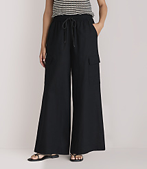 A person wearing black wide-leg cargo pants and a striped top stands against a plain white background. carousel Product Image 2