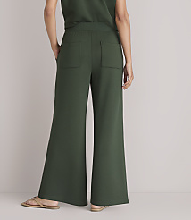 A person wearing green wide-leg pants and sandals stands against a plain white background. carousel Product Image 3
