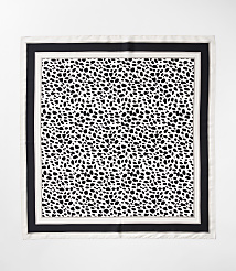 A black and white dalmatian-print scarf with a black border is laid flat against a white background. carousel Product Image 2