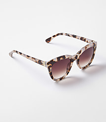 A pair of leopard-print sunglasses rests on a plain white background. carousel Product Image 1