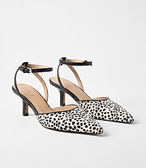 A pair of dalmatian-print kitten heels with ankle straps rests on a plain white background. carousel Product Image 1