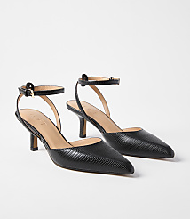 A pair of black, textured leather slingback heels with ankle straps are displayed against a plain white background. carousel Product Image 1