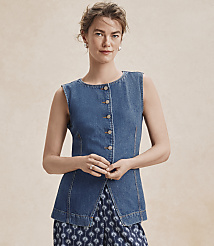 A woman in a denim vest and patterned pants stands against a plain, light background. carousel Product Image 4