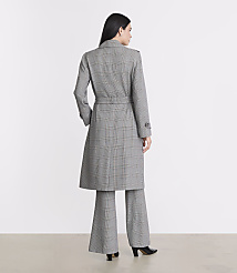 A woman in a plaid trench coat and matching pants stands against a plain white background. carousel Product Image 3