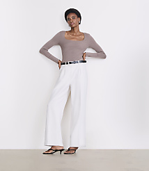 A woman in a taupe square-neck top and white wide-leg pants stands against a plain white background. carousel Product Image 1