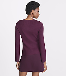 A woman in a burgundy sweater and skirt stands against a plain white background. carousel Product Image 3