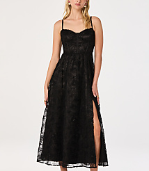 A woman in a black lace dress with a thigh-high slit stands against a plain white background. carousel Product Image 1