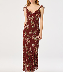 A woman in a floral print dress stands against a plain white background. carousel Product Image 1