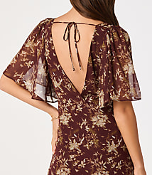 A woman in a floral print dress with flutter sleeves and a tie-back neckline stands against a plain background. carousel Product Image 3
