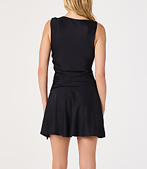 A woman in a black swimsuit with a skirted bottom stands against a plain white background. carousel Product Image 2