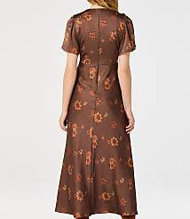 A woman in a brown floral dress stands against a plain white background. carousel Product Image 2