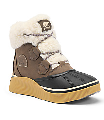A brown Sorel boot with a white fluffy lining and a thick tan sole stands against a plain white background. carousel Product Image 1