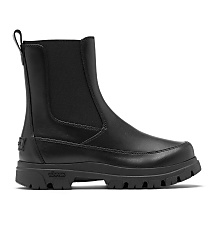 A black leather Chelsea boot with a thick lug sole stands against a plain white background. carousel Product Image 3