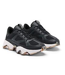 A pair of black Sorel sneakers with chunky white soles and translucent, patterned outsoles rest on a plain white background. carousel Product Image 2