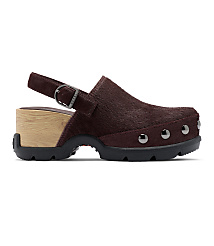 A brown, furry clog with a wooden heel and metal studs sits on a white background. carousel Product Image 3