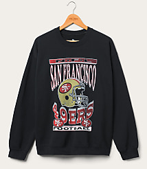 A black San Francisco 49ers sweatshirt with a vintage graphic hangs on a wooden hanger against a plain white background. carousel Product Image 1