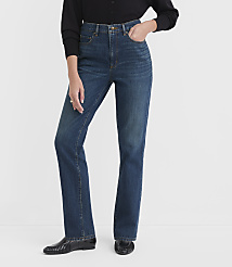 A person in dark blue jeans and a black cardigan stands against a plain white background. carousel Product Image 1