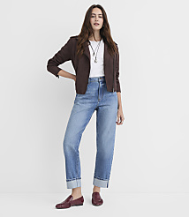 A woman in a brown jacket and cuffed jeans stands against a plain white background. carousel Product Image 1