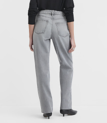 A person wearing grey jeans and black shoes stands against a plain white background. carousel Product Image 2